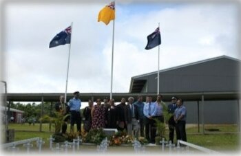 Students in front of flag poles